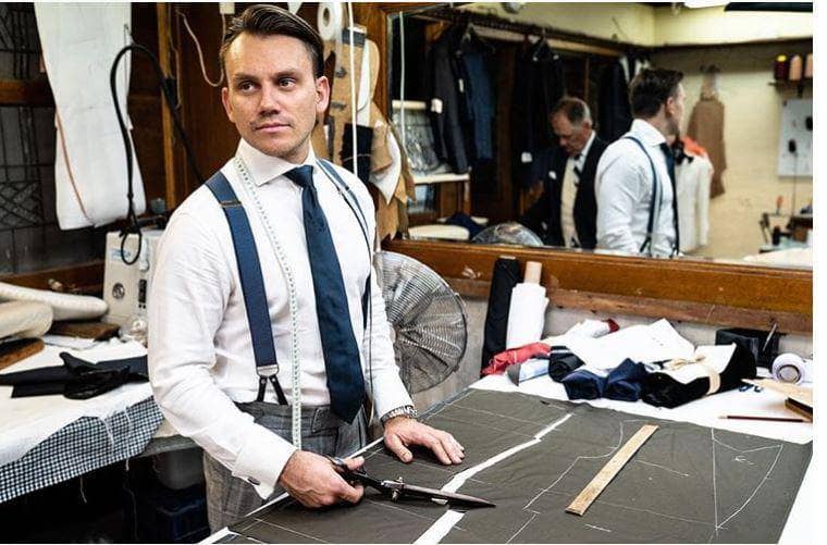 A suit tailor making a tailored suit