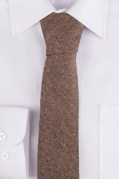 Close up of Classic Brown Barleycorn Tweed Tie on a single cuff shirt