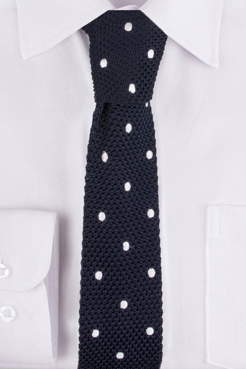 Close up of Navy White Spot Knitted Tie on a White Shirt