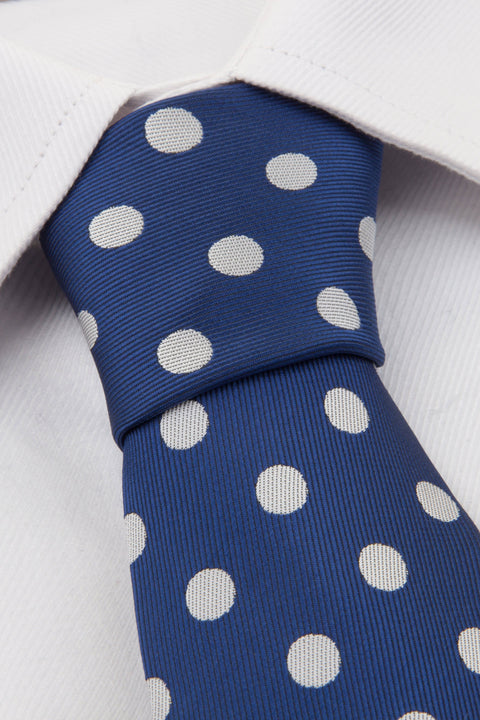Close up of Navy Polkadot Tie on a white shirt
