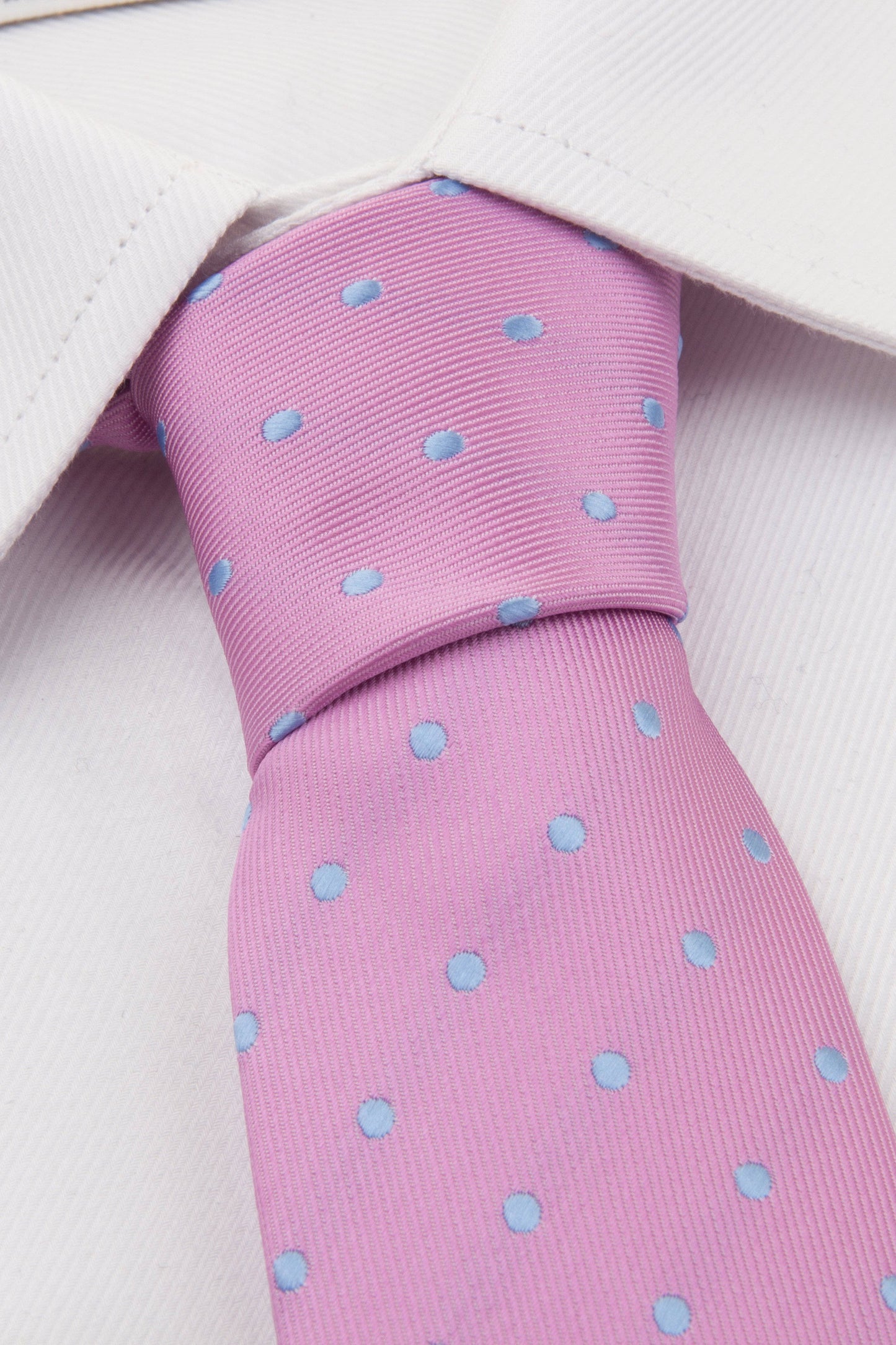 Close up of Pink Blue Spot Tie on a shirt