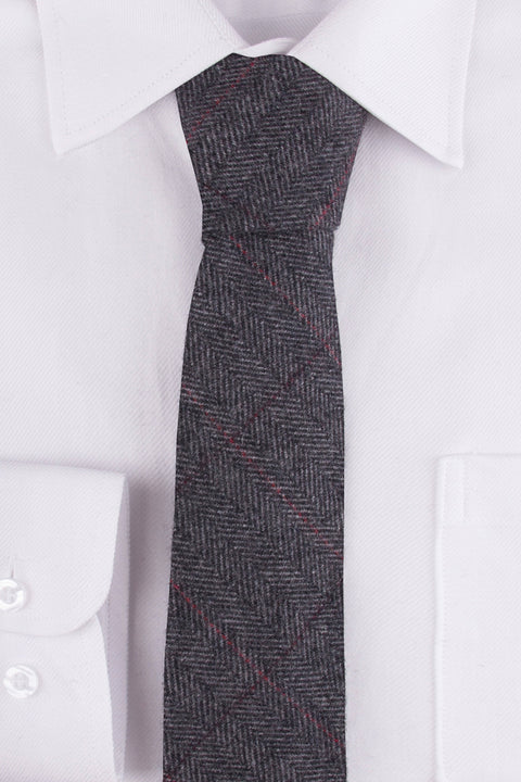 Close up of Traditional Grey Estate Herringbone Tweed Tie on a White single cuff shirt